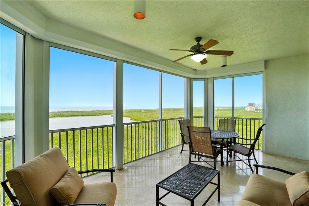 265 Indies Way, Unit 1605 Naples, FL 34110 - Photo 33 of 49 a view of a livingroom with furniture and floor to ceiling window