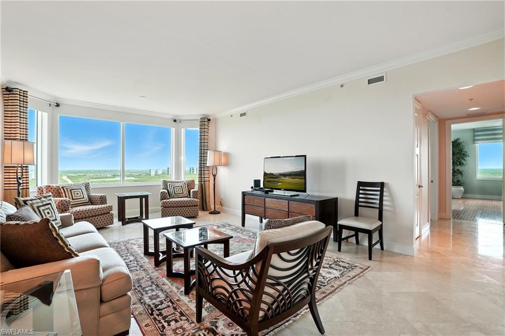 265 Indies Way, Unit 1605 Naples, FL 34110 - Photo 4 of 49 a view of a livingroom with furniture and a table