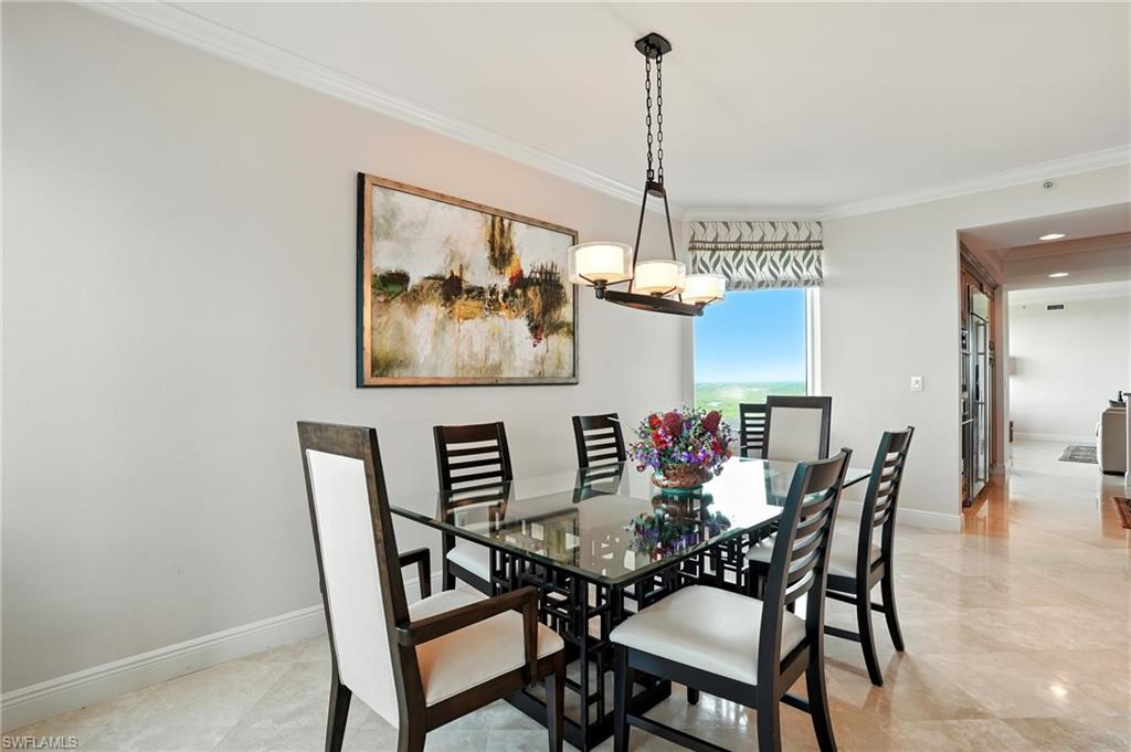 265 Indies Way, Unit 1605 Naples, FL 34110 - Photo 5 of 49 a view of a dining room with furniture window and wooden floor