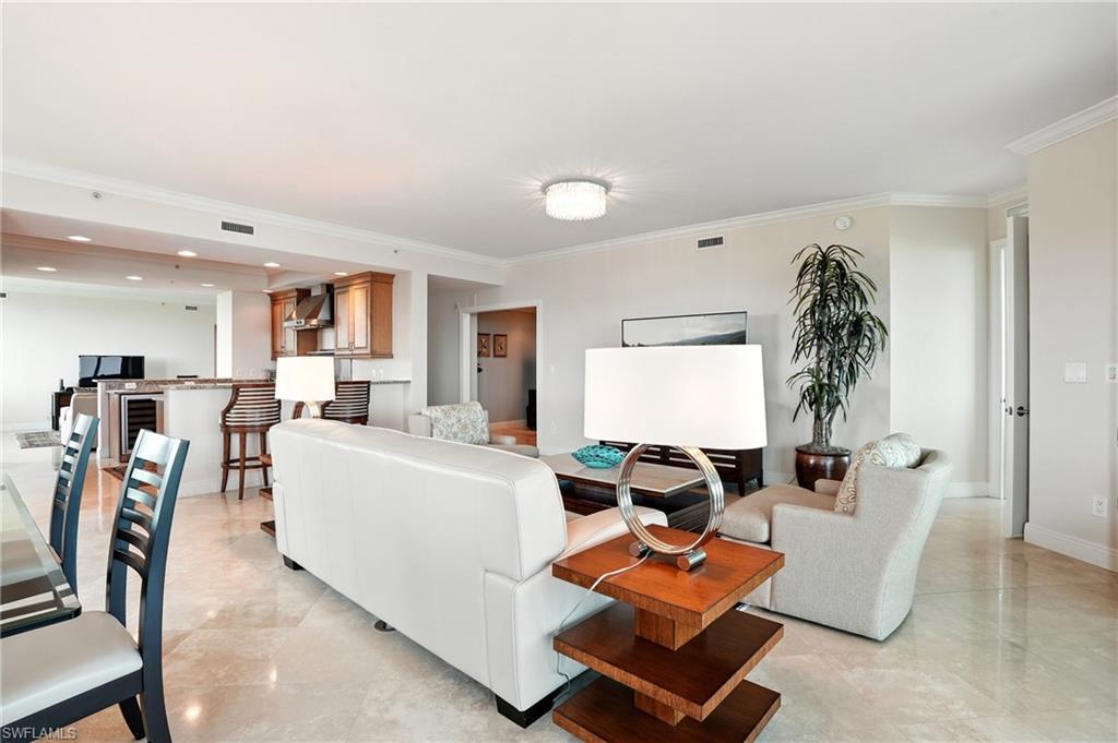 265 Indies Way, Unit 1605 Naples, FL 34110 - Photo 9 of 49 a living room with furniture gym equipment and a window