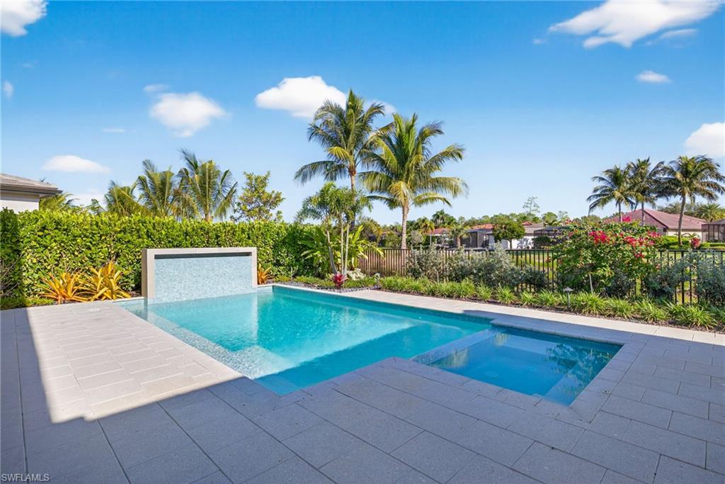 16732 Lucarno Way Naples, FL 34110 - Photo 34 of 50 Pool and spa with views of lake