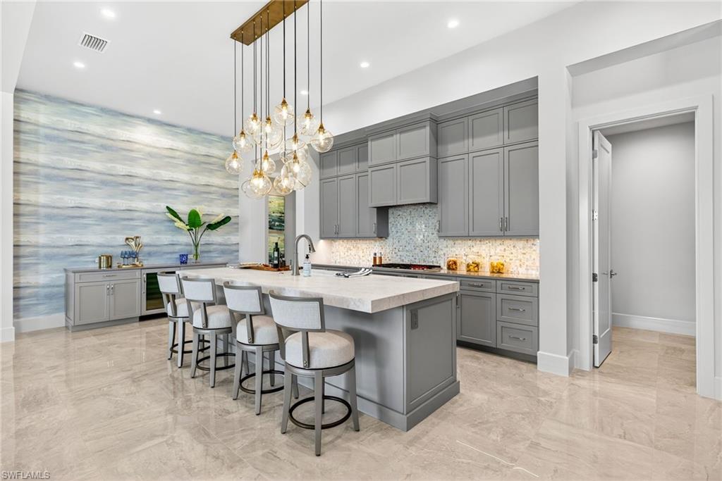 16732 Lucarno Way Naples, FL 34110 - Photo 9 of 50 Kitchen with built-in wine/dry bar