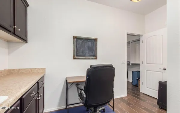 a workspace with furniture and wooden floor