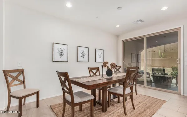 a dining room with furniture and window