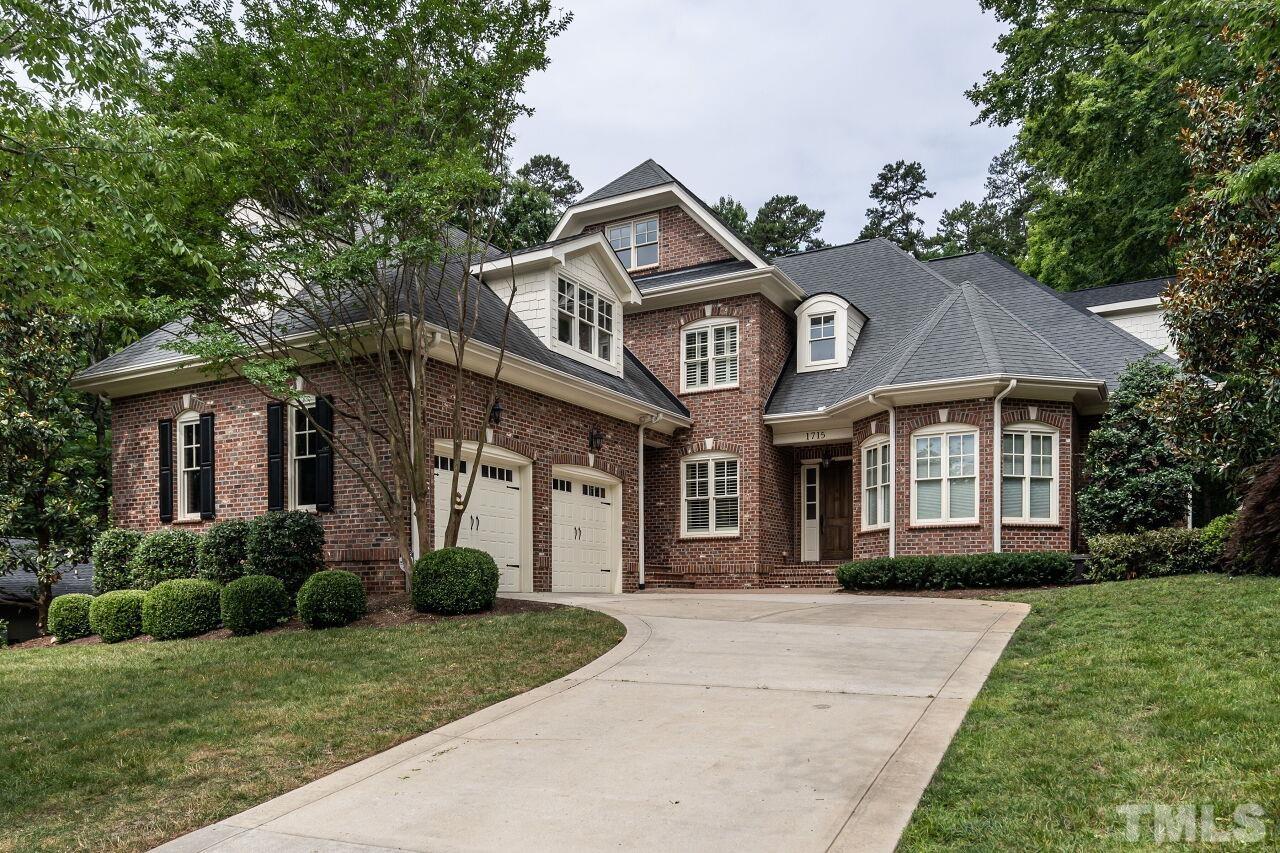 1715 Nottingham Road Raleigh, NC 27607 - Photo 1 of 35 a front view of a house with a garden
