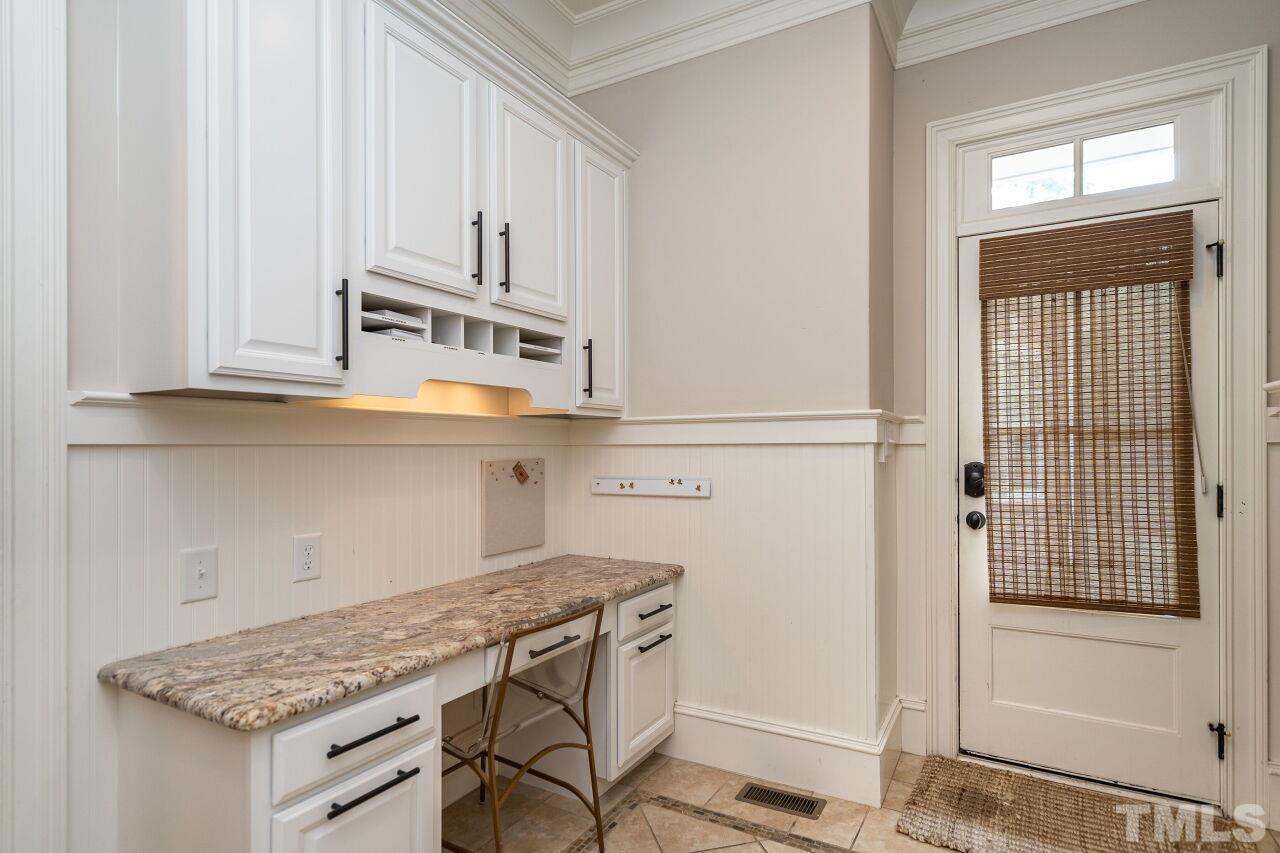 1715 Nottingham Road Raleigh, NC 27607 - Photo 13 of 35 a kitchen with a refrigerator and cabinets