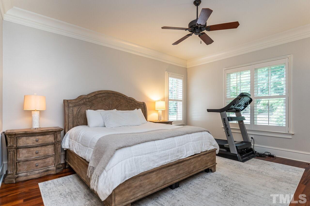 1715 Nottingham Road Raleigh, NC 27607 - Photo 16 of 35 a bedroom with a bed and a chandelier