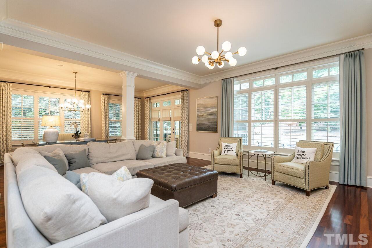 1715 Nottingham Road Raleigh, NC 27607 - Photo 4 of 35 a living room with furniture and a chandelier