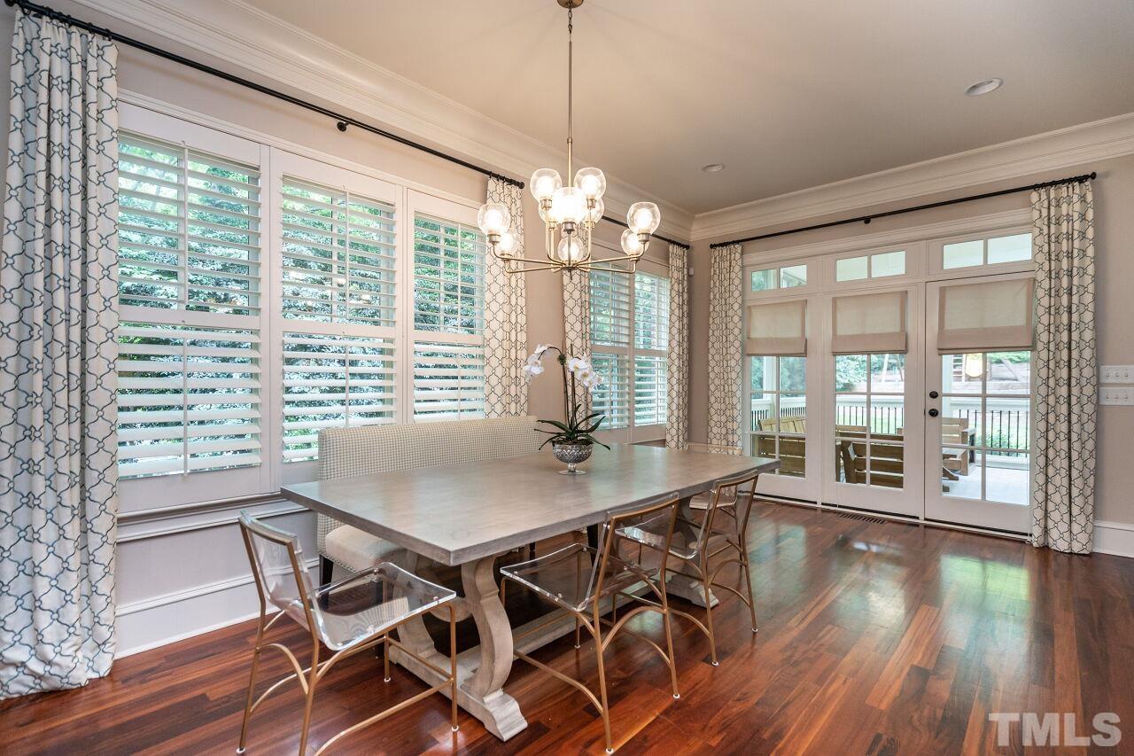 1715 Nottingham Road Raleigh, NC 27607 - Photo 7 of 35 a view of a dining room with furniture window and wooden floor