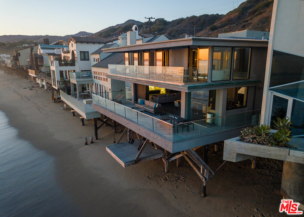 24450 Malibu Road Malibu, CA 90265 - Photo 32 of 34 a front view of a house with a wooden deck