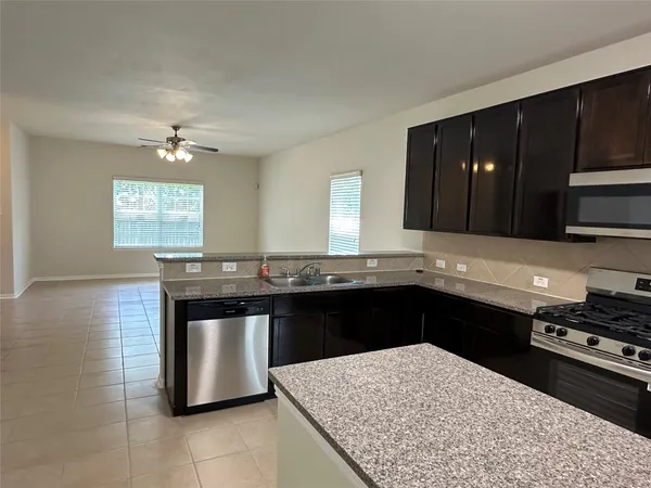 a kitchen with a stove and a sink
