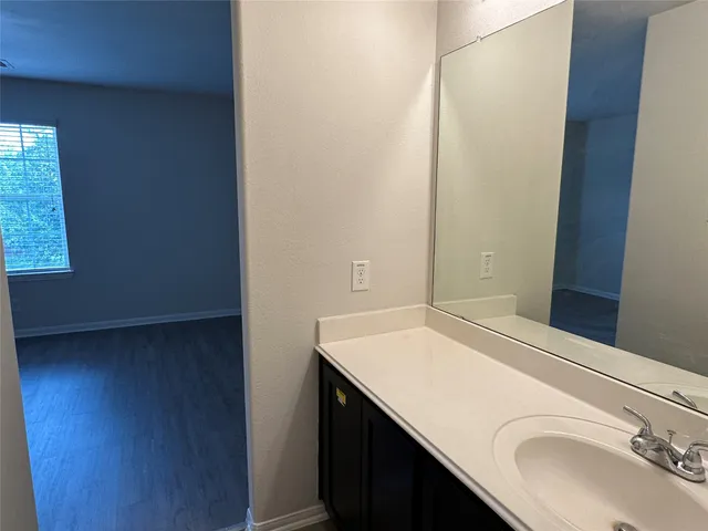 a view of a bathroom from the hallway