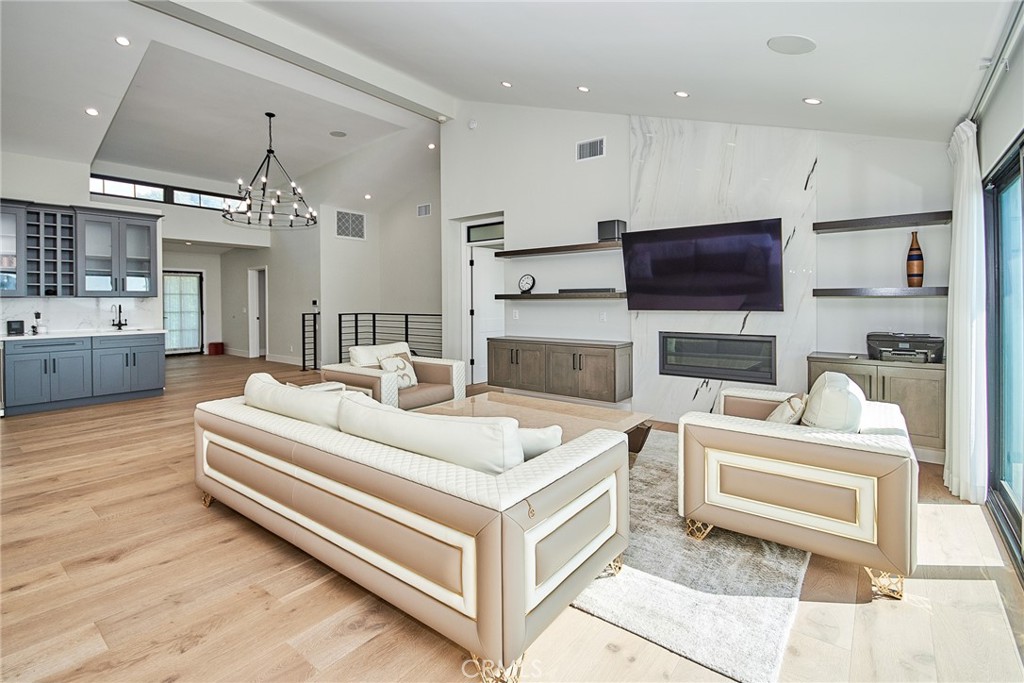 243 Notteargenta Road Pacific Palisades, CA 90272 - Photo 17 of 56 a living room with furniture and a flat screen tv