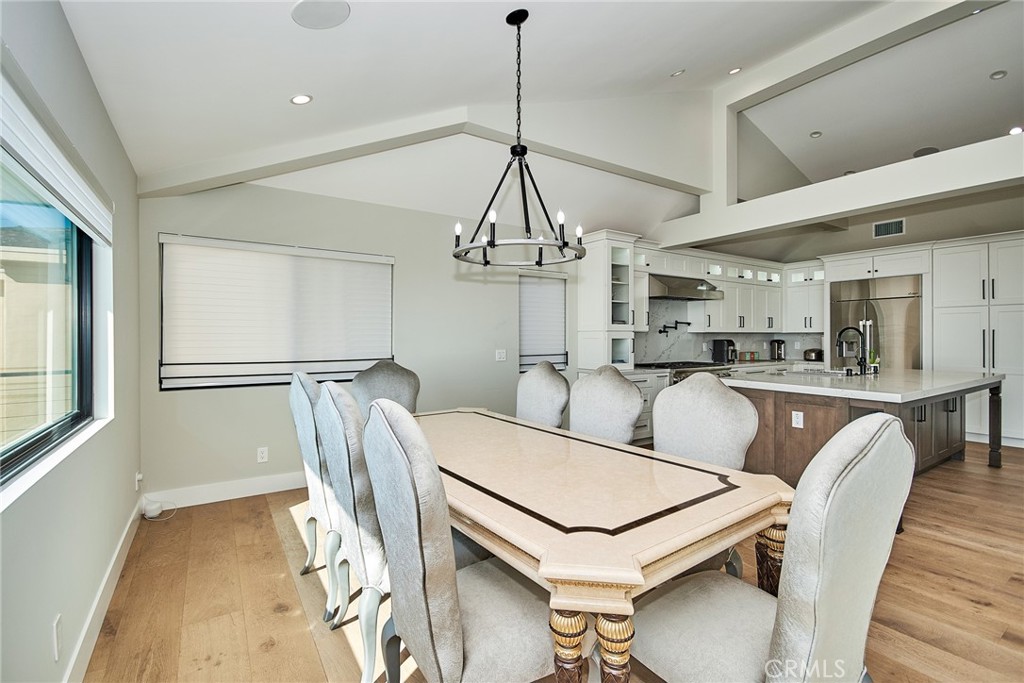 243 Notteargenta Road Pacific Palisades, CA 90272 - Photo 18 of 56 a dining room with furniture and window