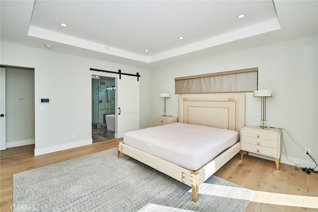 243 Notteargenta Road Pacific Palisades, CA 90272 - Photo 29 of 56 a bedroom with a bed and a dresser