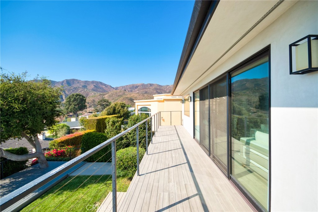 243 Notteargenta Road Pacific Palisades, CA 90272 - Photo 31 of 56 a view of a balcony with an ocean view