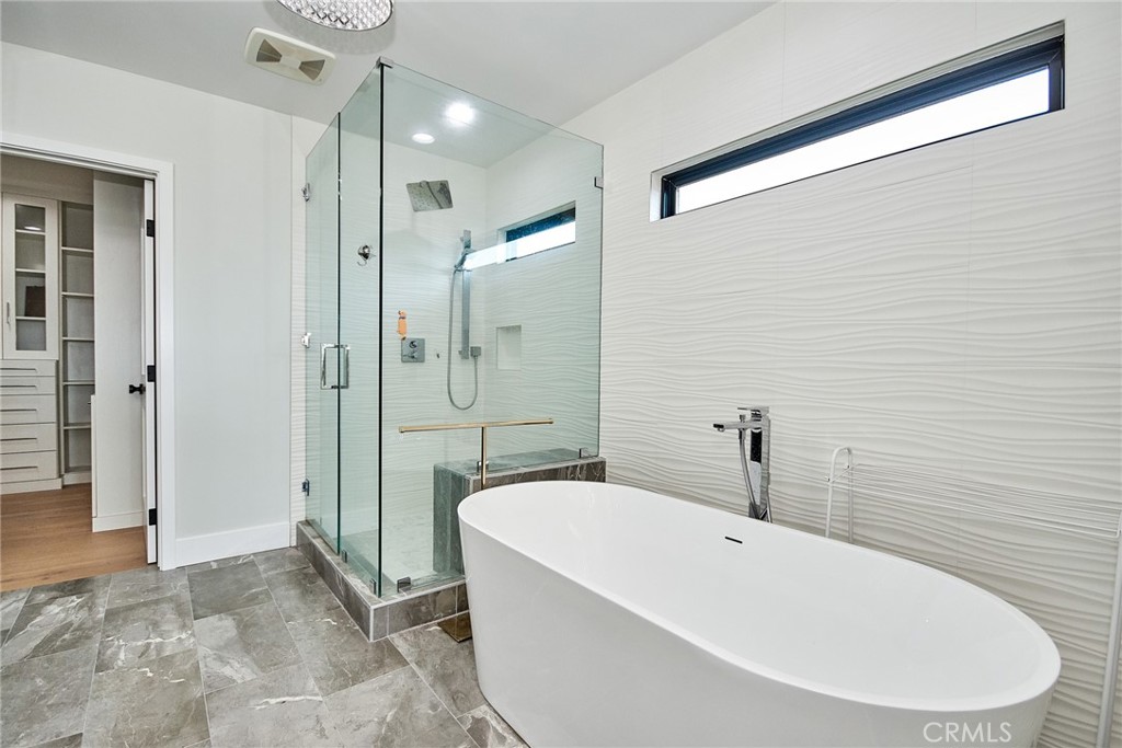 243 Notteargenta Road Pacific Palisades, CA 90272 - Photo 37 of 56 a bathroom with a bathtub and a shower