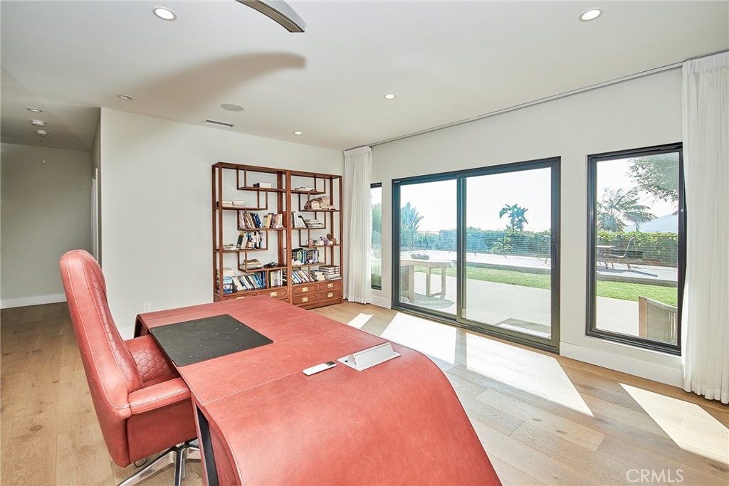 243 Notteargenta Road Pacific Palisades, CA 90272 - Photo 49 of 56 a bedroom with a bed and a large window