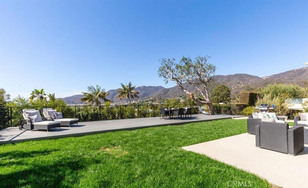 243 Notteargenta Road Pacific Palisades, CA 90272 - Photo 5 of 56 a view of a garden with houses