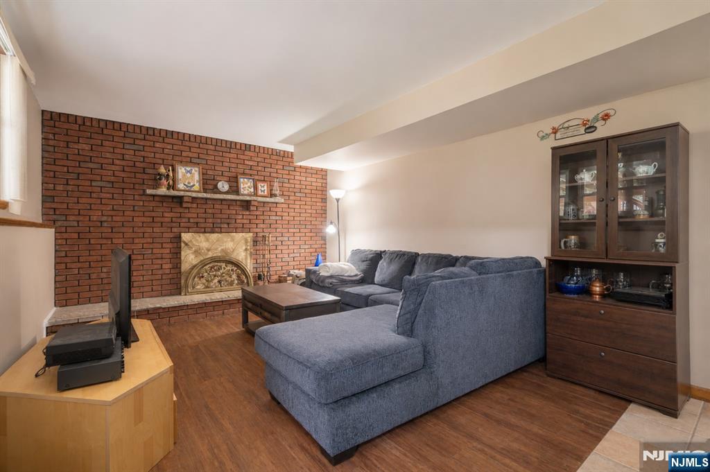 55 Marcia Road Ringwood, NJ 07456 - Photo 24 of 42 a living room with furniture and a fireplace