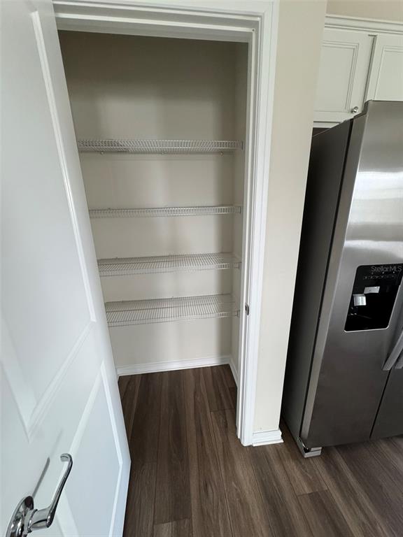 6350 Rover Way St. Cloud, FL 34771 - Photo 7 of 14 a view of walk in closet with empty racks