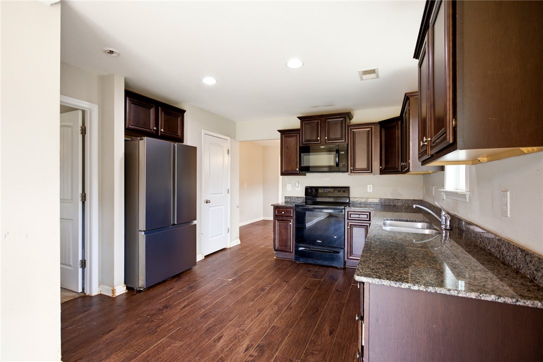 245 Maple Grove Road Seneca, SC 29678 - Photo 13 of 40 This spacious kitchen features ample cabinet storage and sleek, functional countertops.