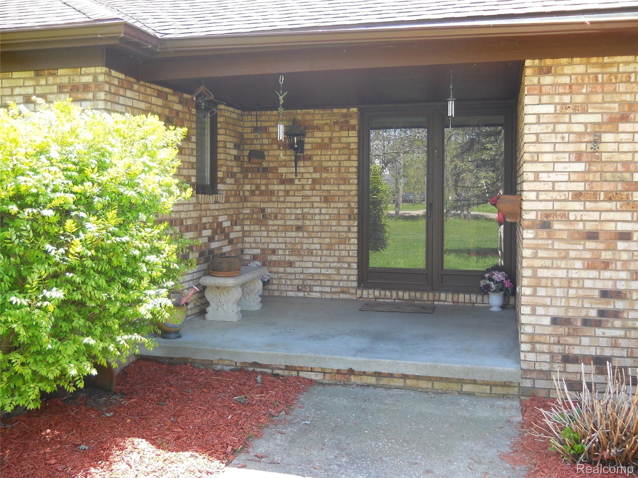 5929 Layton Road Fowlerville, MI 48836 - Photo 3 of 24 covered front porch