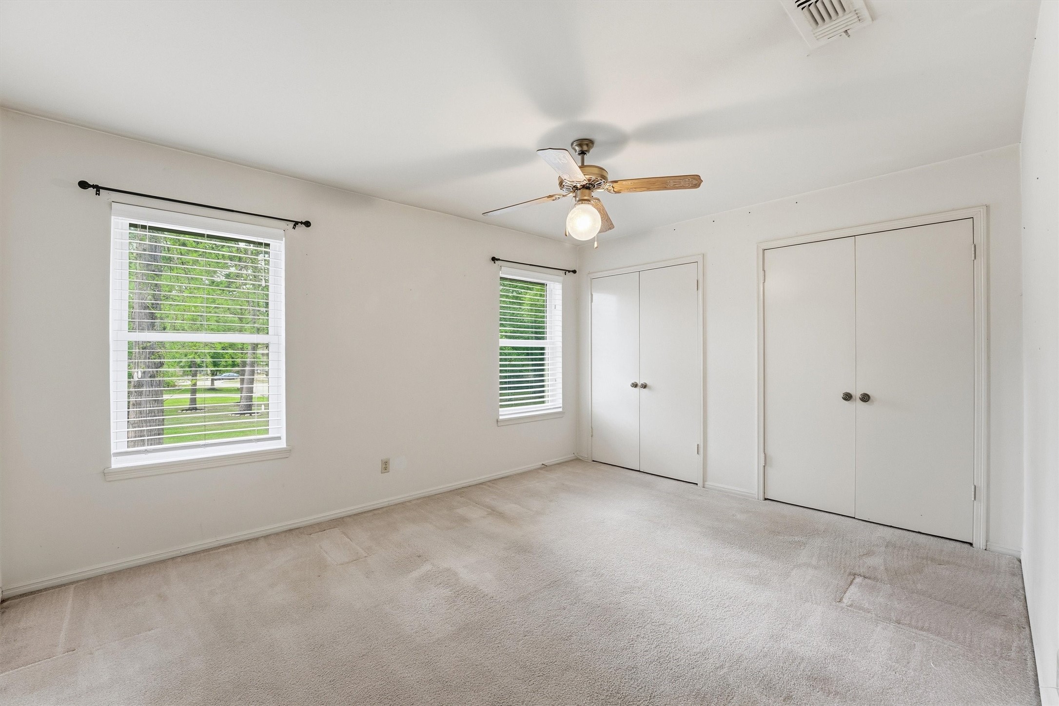 8115 Theisswood Road Spring, TX 77379 - Photo 23 of 36 a view of an empty room with a window