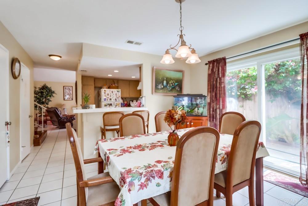 2010 Bridgeport Chula Vista, CA 91913 - Photo 12 of 43 a dining room with furniture a chandelier and window