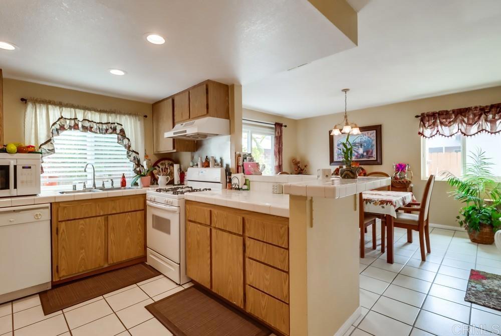 2010 Bridgeport Chula Vista, CA 91913 - Photo 17 of 43 a kitchen with sink cabinets and window