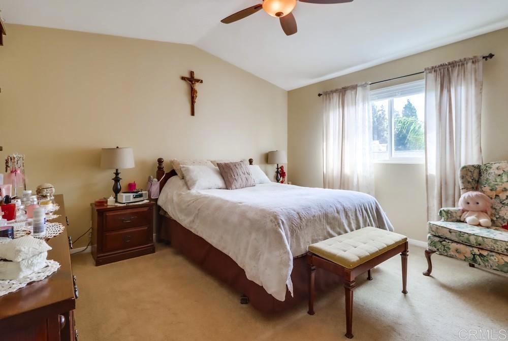 2010 Bridgeport Chula Vista, CA 91913 - Photo 21 of 43 a bedroom with a bed and a chandelier