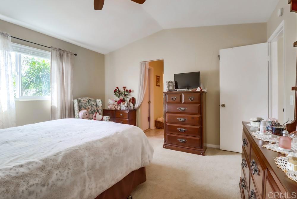 2010 Bridgeport Chula Vista, CA 91913 - Photo 22 of 43 a bedroom with a bed and a flat tv screen on dresser