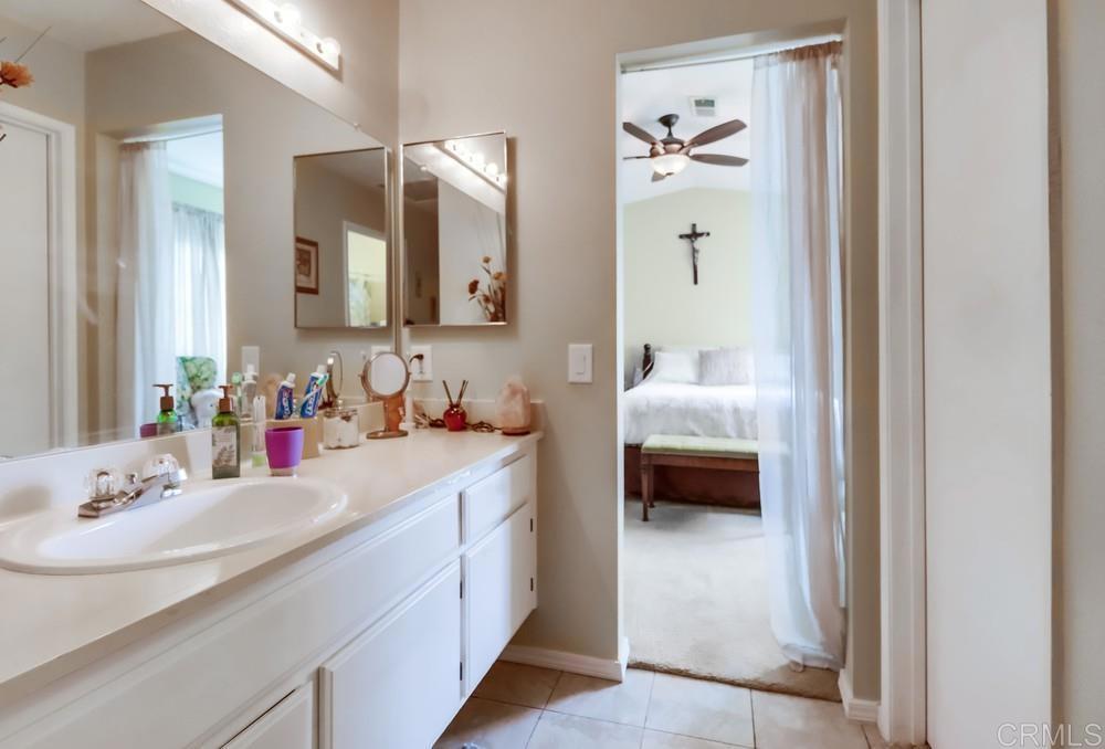 2010 Bridgeport Chula Vista, CA 91913 - Photo 27 of 43 a en suite bathroom with a double vanity sink and mirror