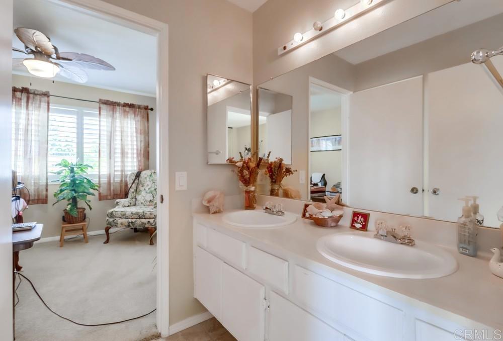 2010 Bridgeport Chula Vista, CA 91913 - Photo 34 of 43 a bathroom with double vanity sinks a large mirror and a window