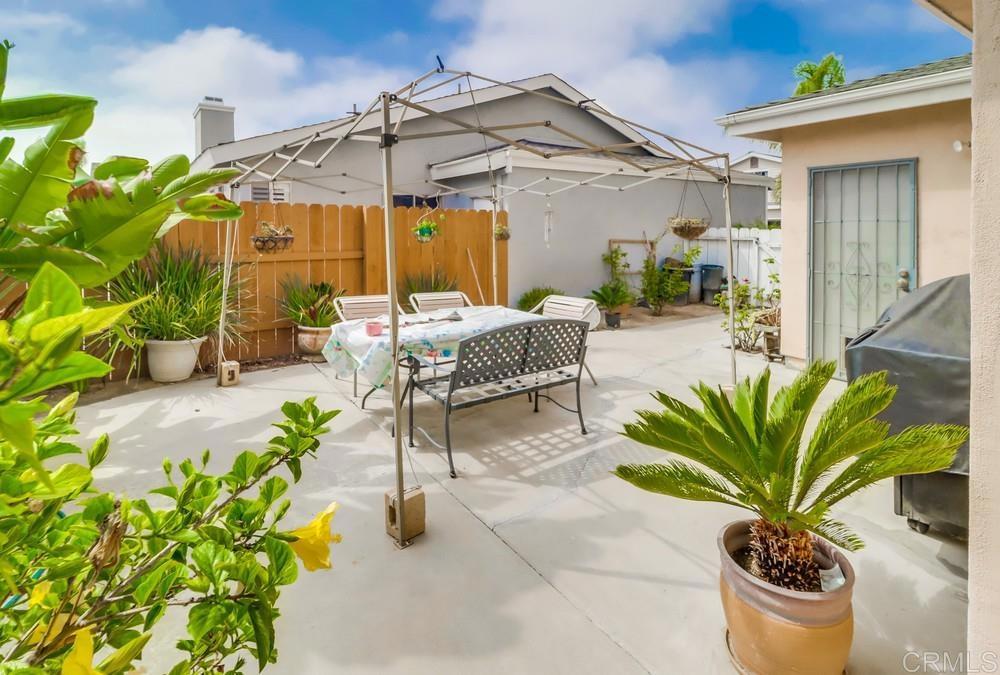 2010 Bridgeport Chula Vista, CA 91913 - Photo 36 of 43 a view of a chair and tables in the patio with potted plants