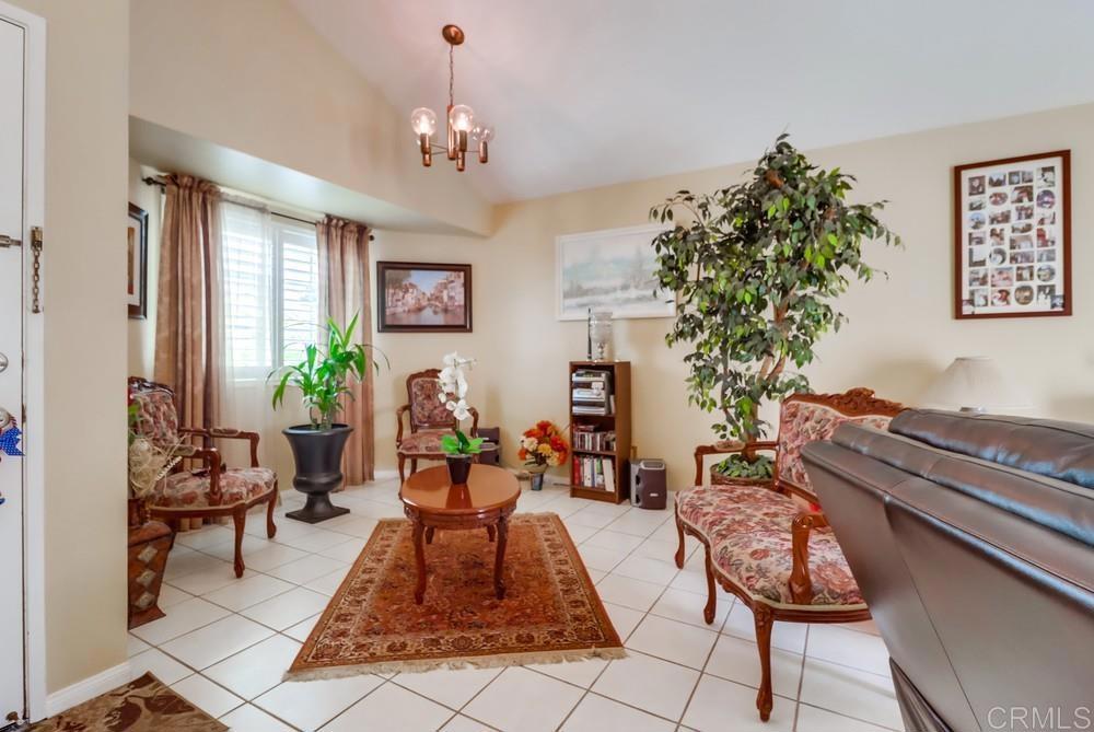 2010 Bridgeport Chula Vista, CA 91913 - Photo 8 of 43 a living room with furniture and a chandelier