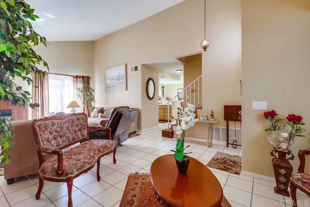 2010 Bridgeport Chula Vista, CA 91913 - Photo 9 of 43 a living room with furniture potted plant and a fireplace