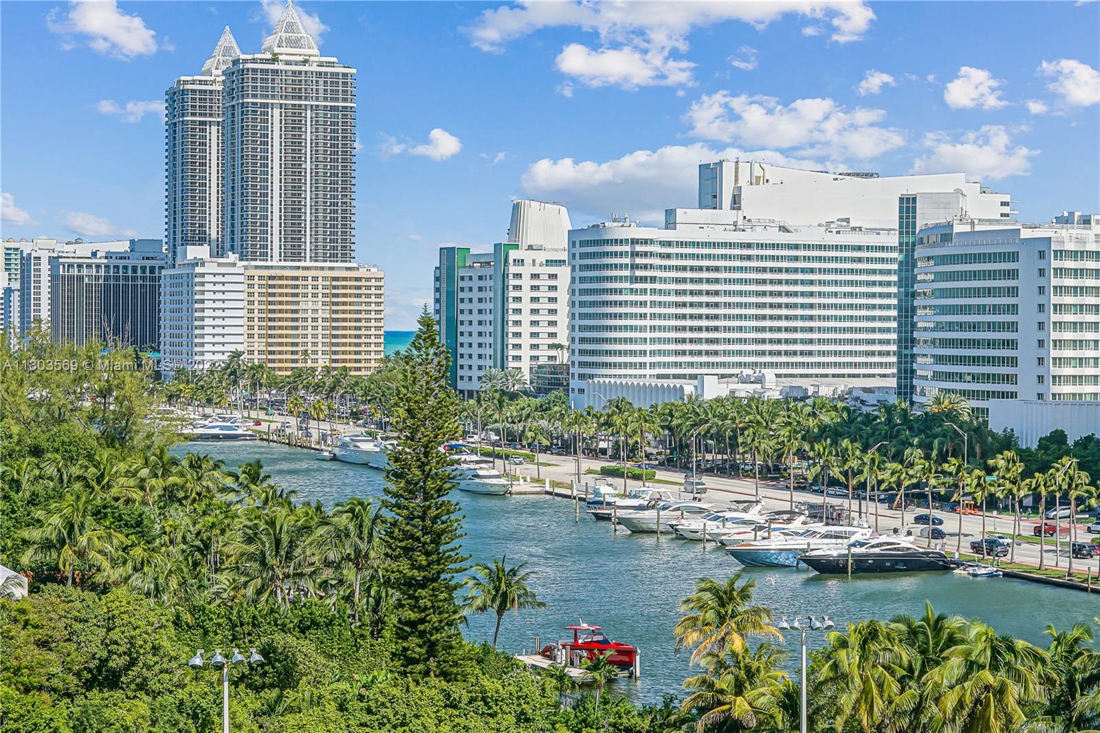 4101 Pine Tree Drive, Unit 908 Miami Beach, FL 33140 - Photo 13 of 41 a view of a house with swimming pool and sitting area