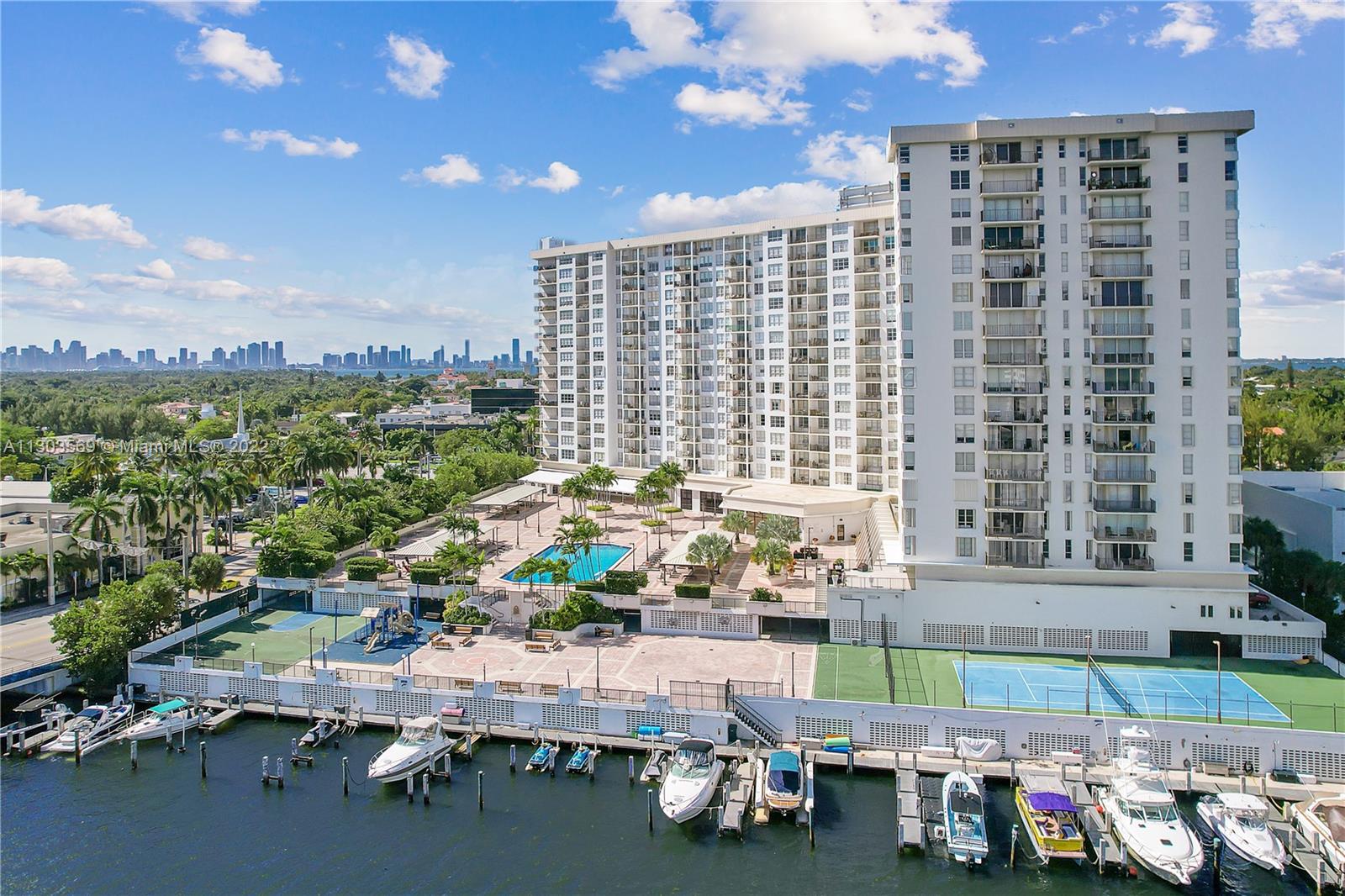 4101 Pine Tree Drive, Unit 908 Miami Beach, FL 33140 - Photo 4 of 41 a room with furniture and a large window