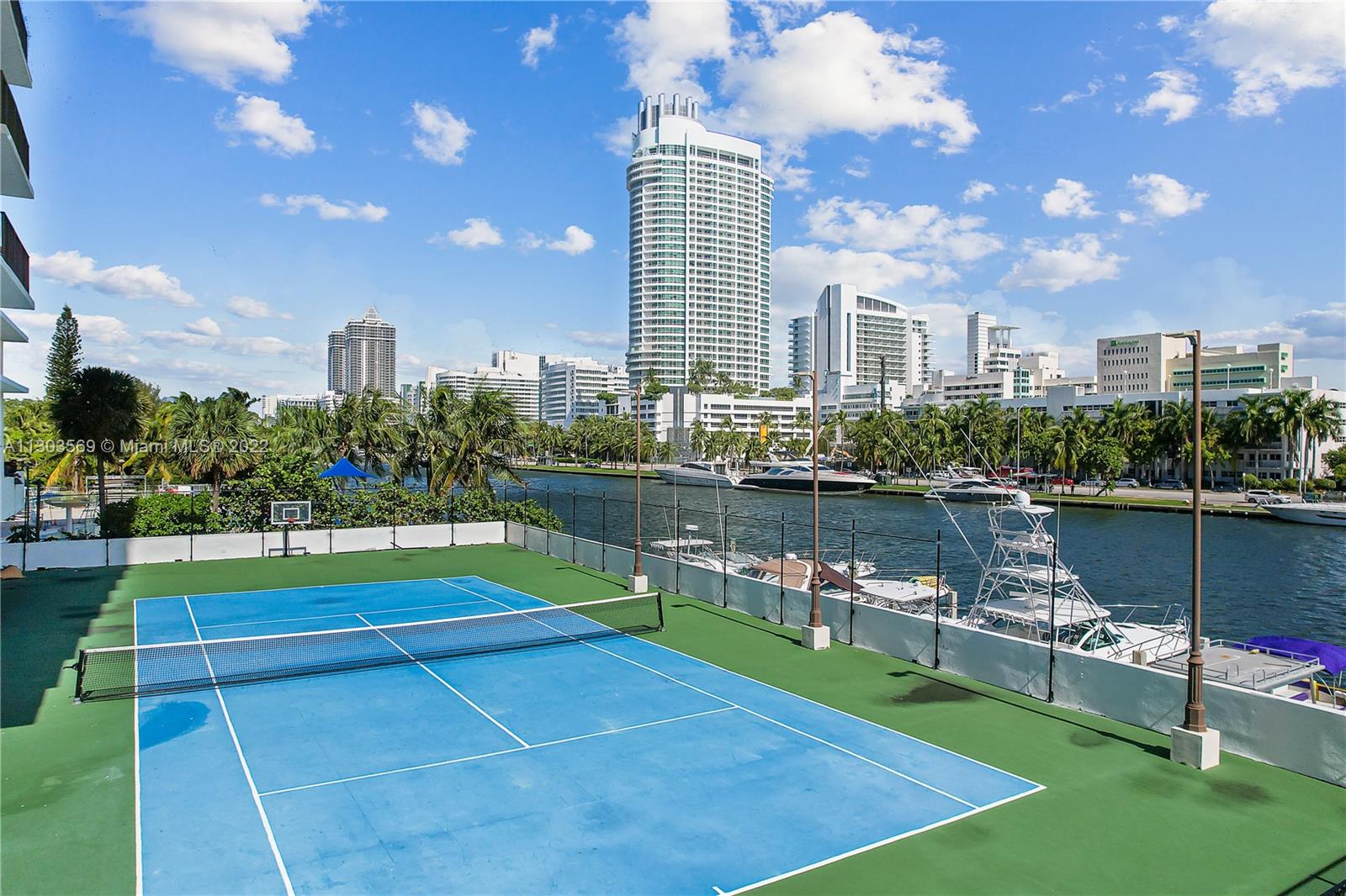 4101 Pine Tree Drive, Unit 908 Miami Beach, FL 33140 - Photo 10 of 41 a view of a lake with a terrace