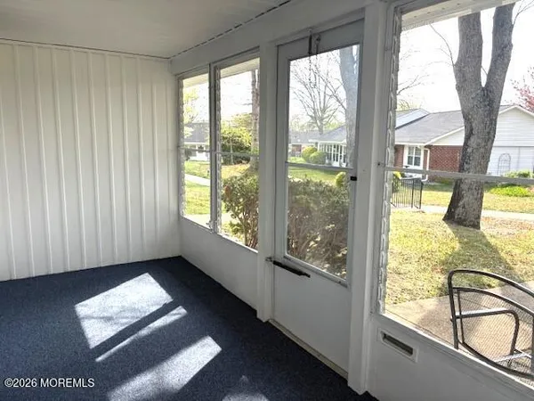 a view of a porch and a yard