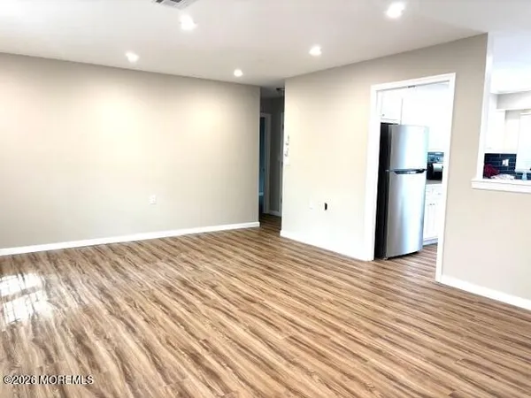 a view of a livingroom with wooden floor