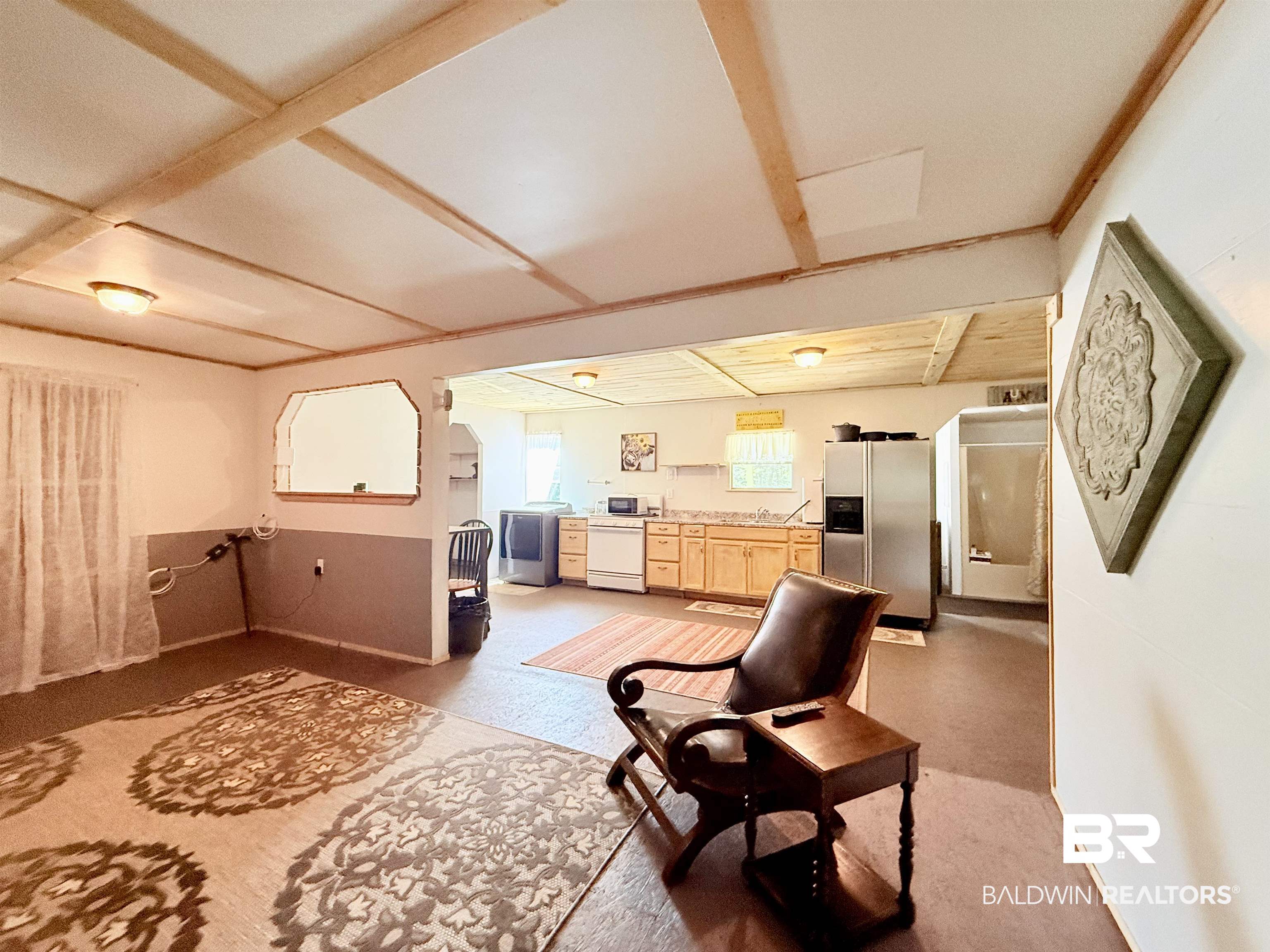 21305 River Road Robertsdale, AL 36567 - Photo 43 of 50 Living room with washer / clothes dryer and baseboards
