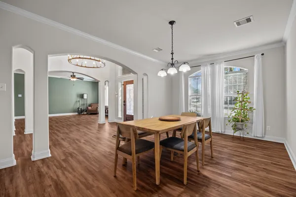 a view of a dining room with furniture window and wooden floor