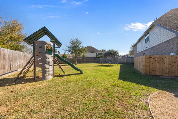 a view of swimming pool with a yard