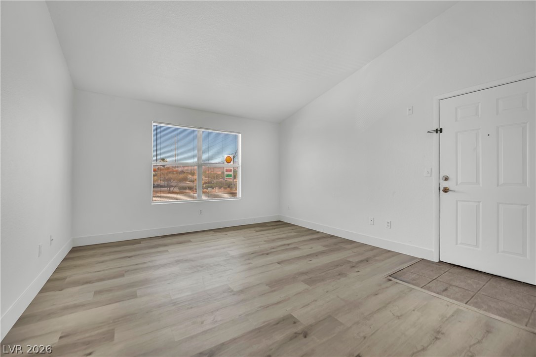 8101 West Flamingo Road, Unit 2030 Las Vegas, NV 89147 - Photo 18 of 27 A well-lit room showcases modern flooring and a broad window.