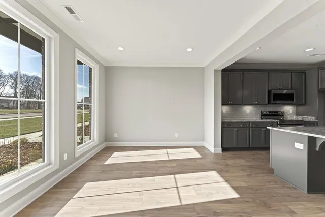 a kitchen with stainless steel appliances granite countertop a stove and a sink