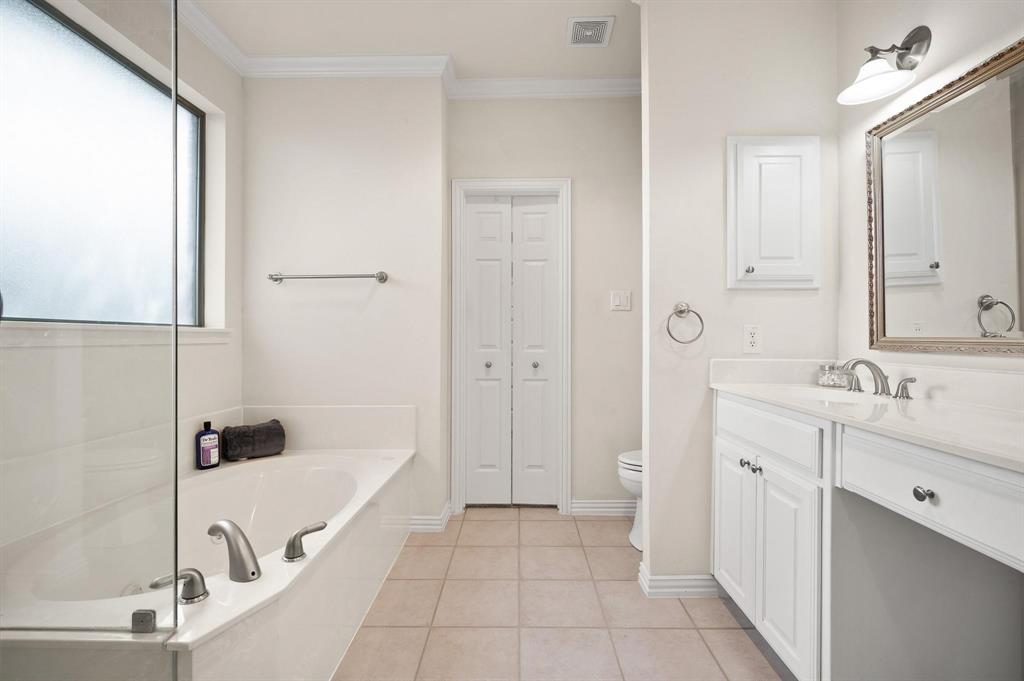 4209 Sexton Lane Dallas, TX 75229 - Photo 17 of 27 a bathroom with a tub sink and mirror