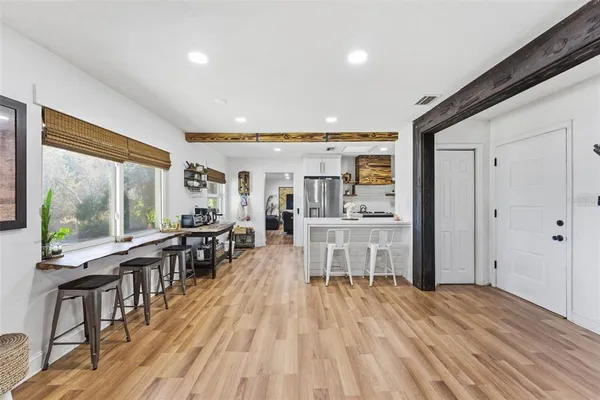 a kitchen with stainless steel appliances a sink stove and refrigerator