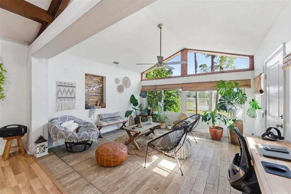 a living room with furniture and a large window